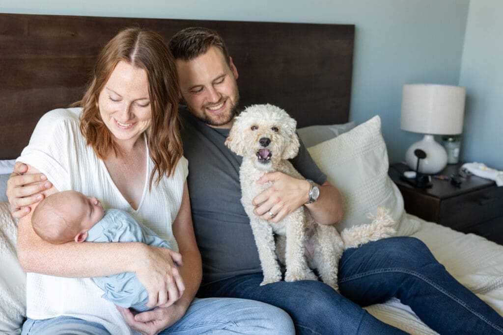 Family portrait including a dog and newborn baby at an at home session in Milwaukee.