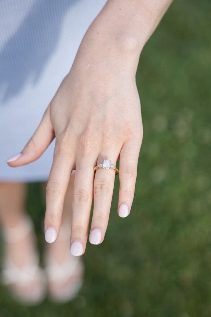 An image of a diamond ring that the woman just received from her fiance.