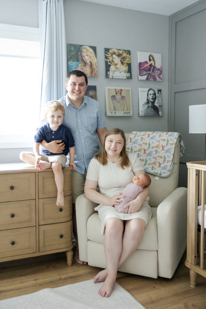 A family picture during a in-home family session in Milwaukee, taken in the baby's nursery.
