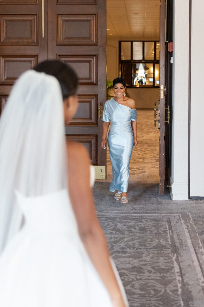 Mother of the bride getting her first look at her daughter in her wedding dress.