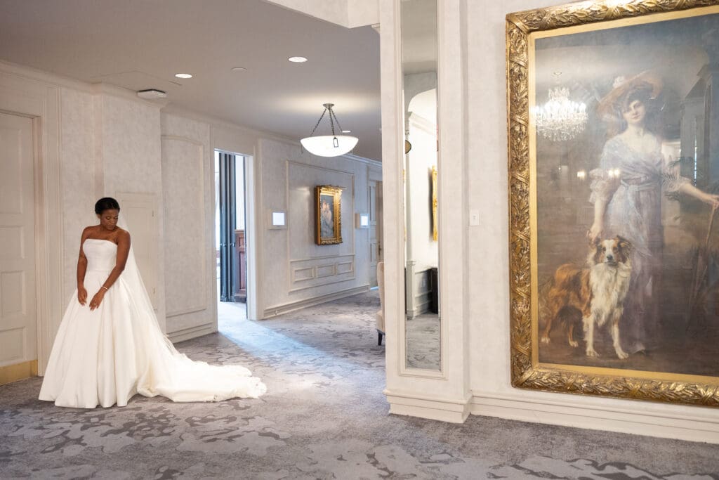 Bride walking in the hallway of The Pfister Hotel in Milwaukee