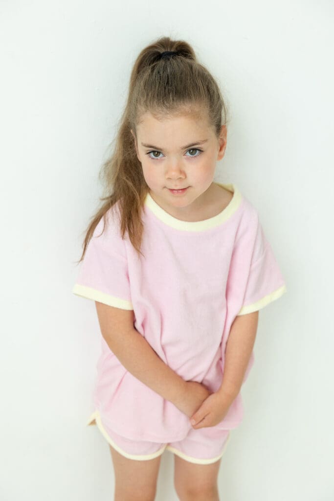 Studio shoot with girl wearing clothing from Alarae Kids Clothing.