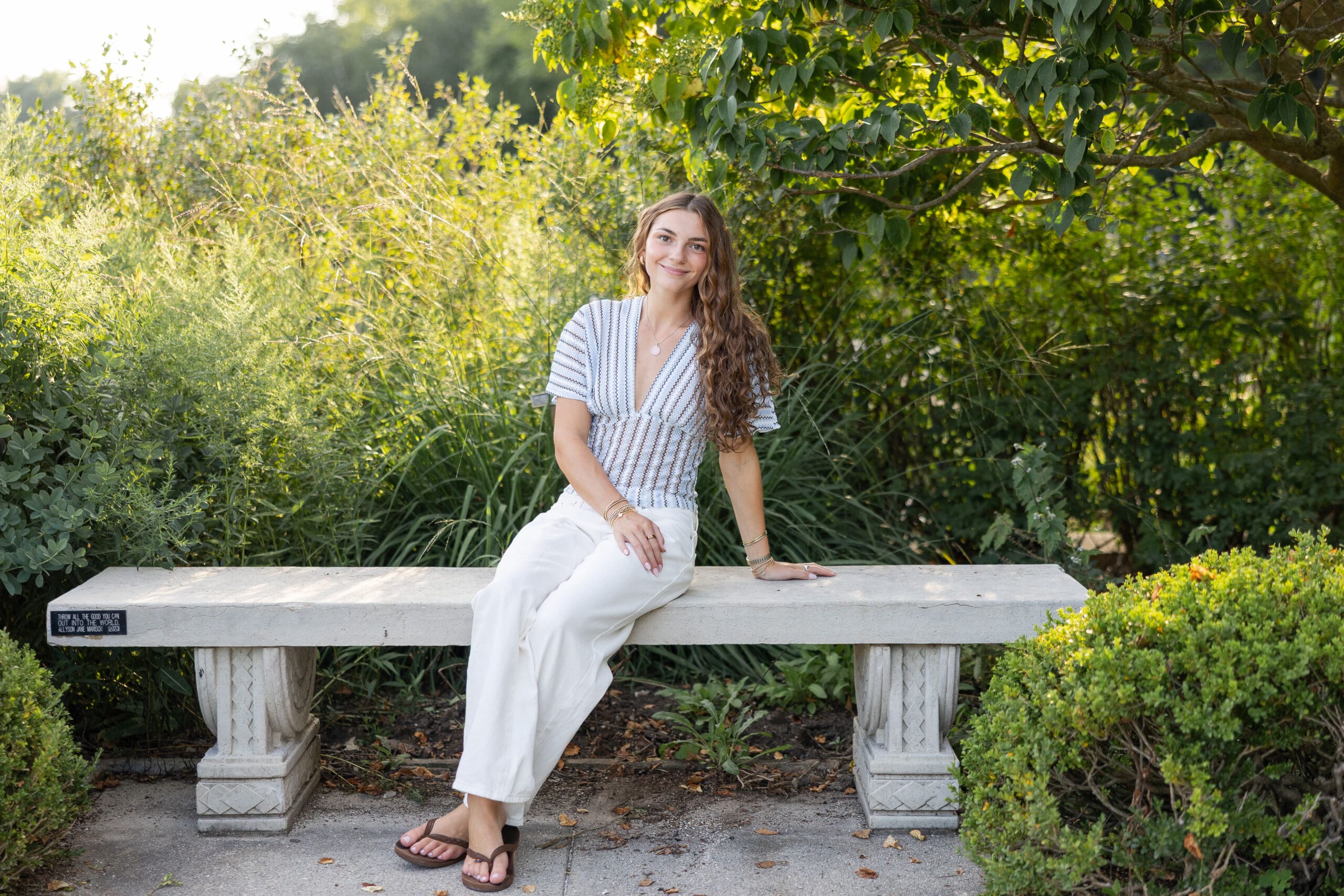 Girl sitting on a bench at Boerner Botanical Gardens