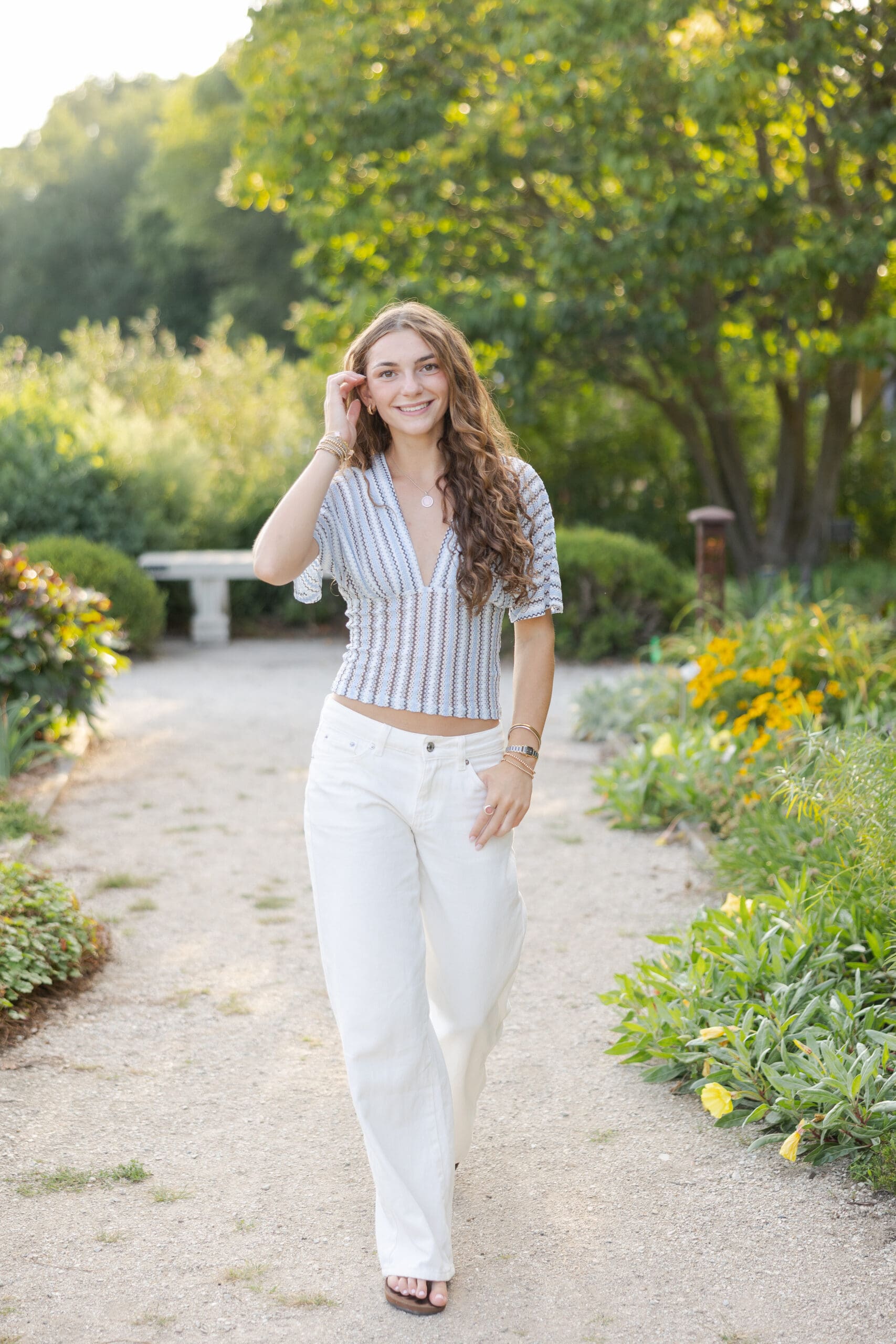 walking on a flower path for senior pictures