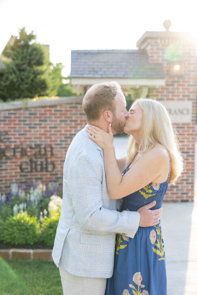 Newly engaged couple kissing at The American Club in Kohler.
