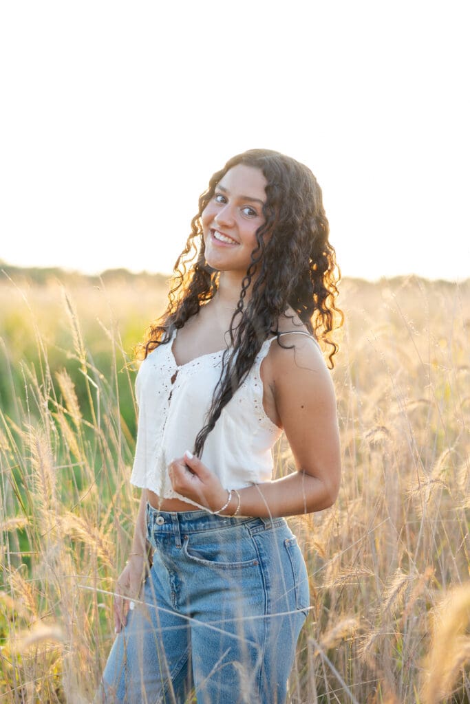 A senior in highschool posing for a photo shoot at Mequon Nature Preserve.