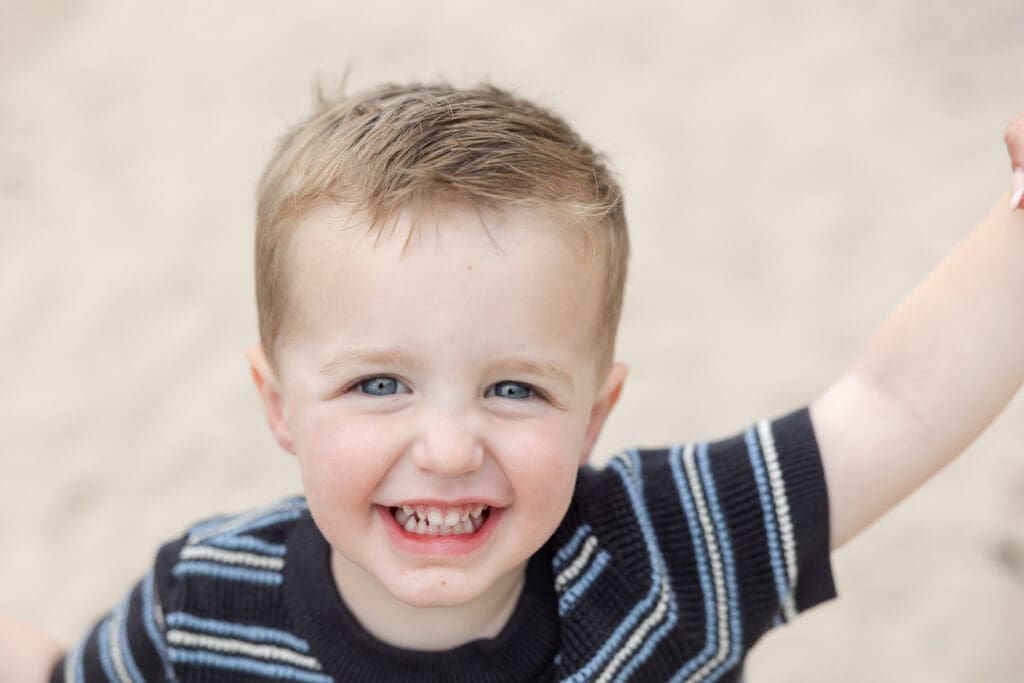 Milwaukee Photo Company photograph of a young toddler boy smiling in a close up.  
