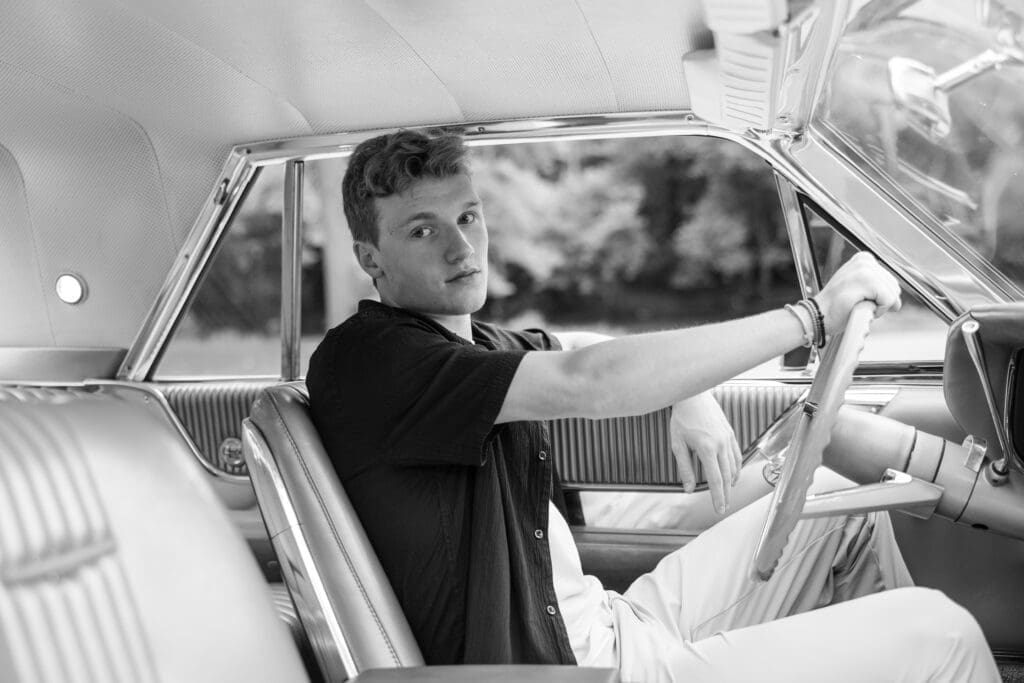 Senior in highschool driving his grandfathers classic car.