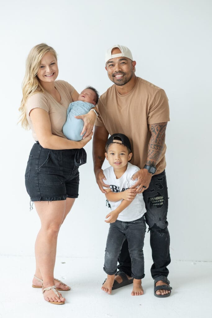 Big brother meeting newborn baby during Milwaukee studio session