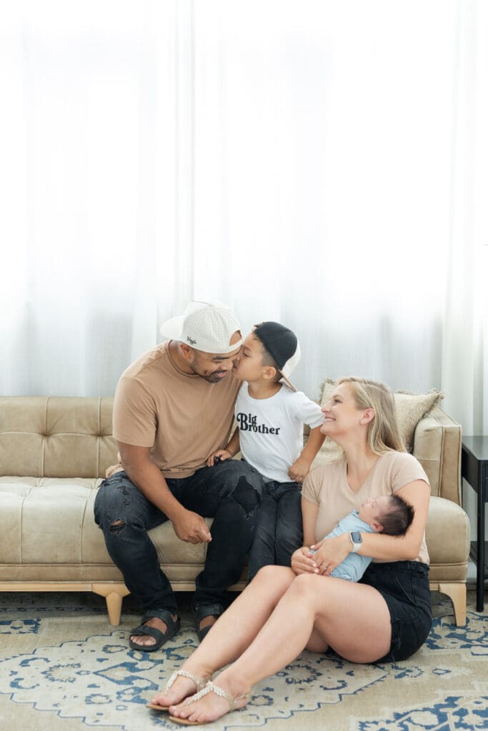 Big brother meeting newborn baby during Milwaukee studio session